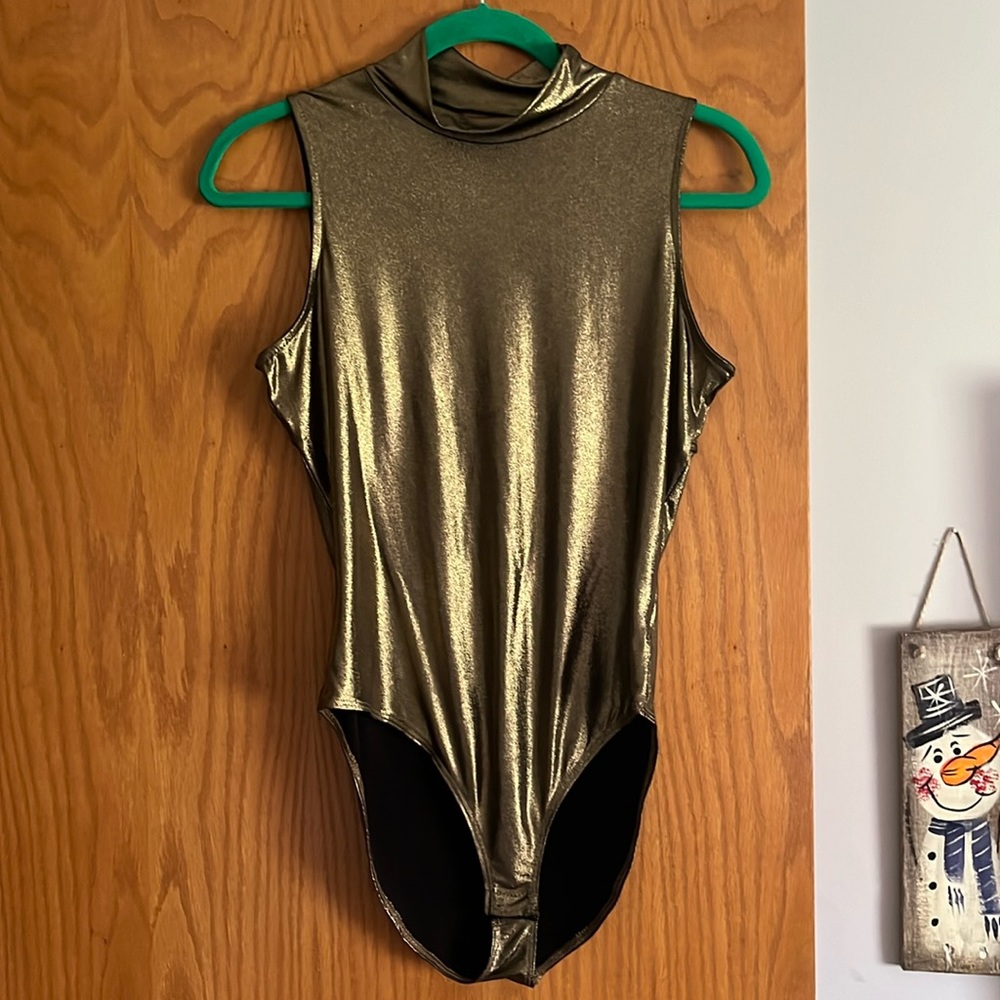 Gold shimmery soprano body suite